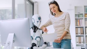An image of a woman showing a robot her shopping list.